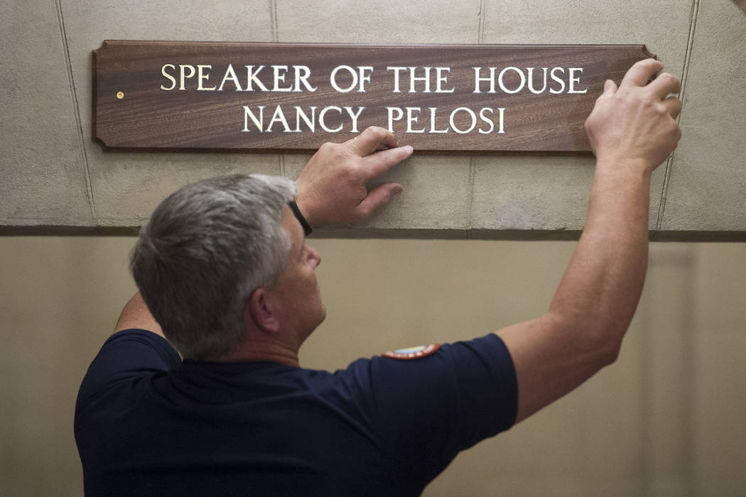 The sign at the office suite of House Speaker Nancy Pelosi of Calif., is installed on Capitol Hill in Washington, Thursday, Jan. 3, 2019, during the opening session of the 116th Congress. (AP Phot ...