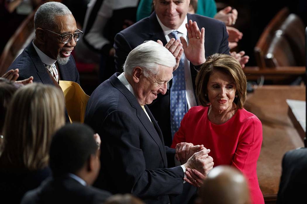 House Democratic Leader Nancy Pelosi of California, who is expected to lead the 116th Congress as speaker of the House, and House Minority Whip Steny Hoyer, D-Md., are applauded at the Capitol in ...