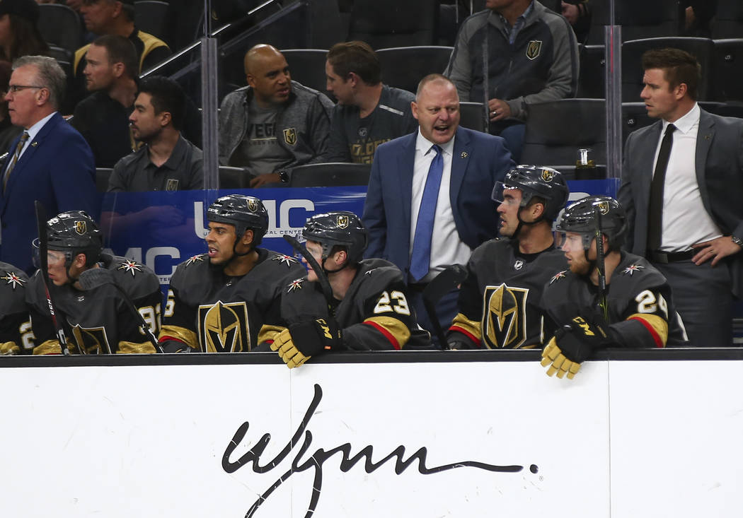 Golden Knights head coach Gerard Gallant, center right, talks to his team during the second period of an NHL hockey game against the Washington Capitals at T-Mobile Arena in Las Vegas on Tuesday, ...