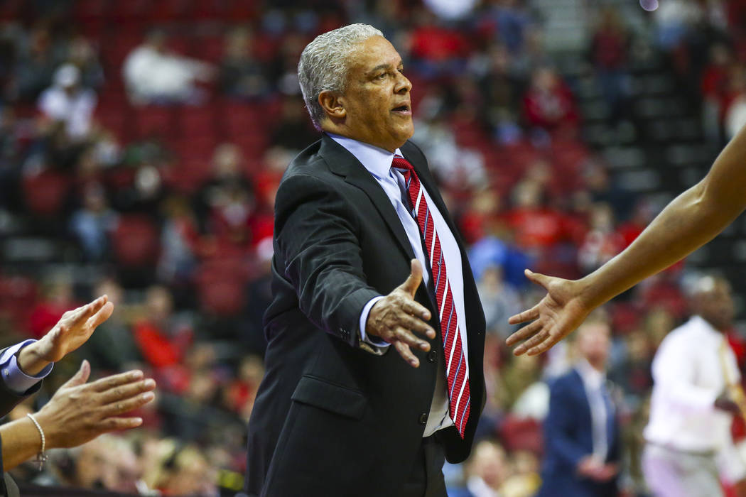 UNLV Rebels head coach Marvin Menzies reaches out to a player during the second half of a basketball game against Wyoming at the Thomas & Mack Center in Las Vegas on Saturday, Jan. 5, 2019. Ch ...
