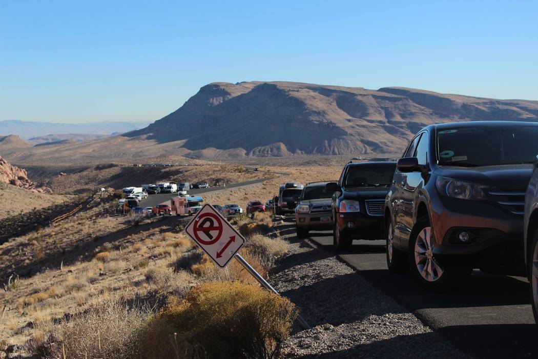 Cars line the side of the scenic loop at Red Rock Canyon National Conservation Area on Thursday, Jan. 3, 2019. (Max Michor/Las Vegas Review-Journal)