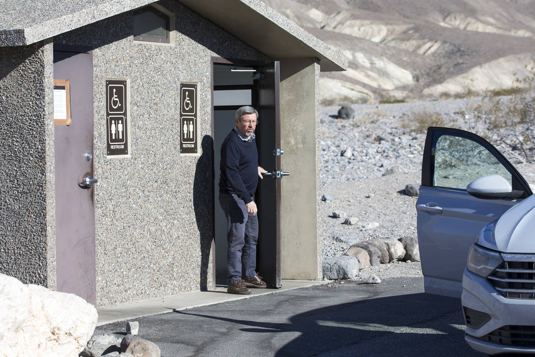 Jean-Claude Lefebure of Belgium exits a restroom along State Route 190 at Death Valley National Park in Calif., on Friday, Jan. 4, 2019. Several restrooms near the east entrance of the park remain ...