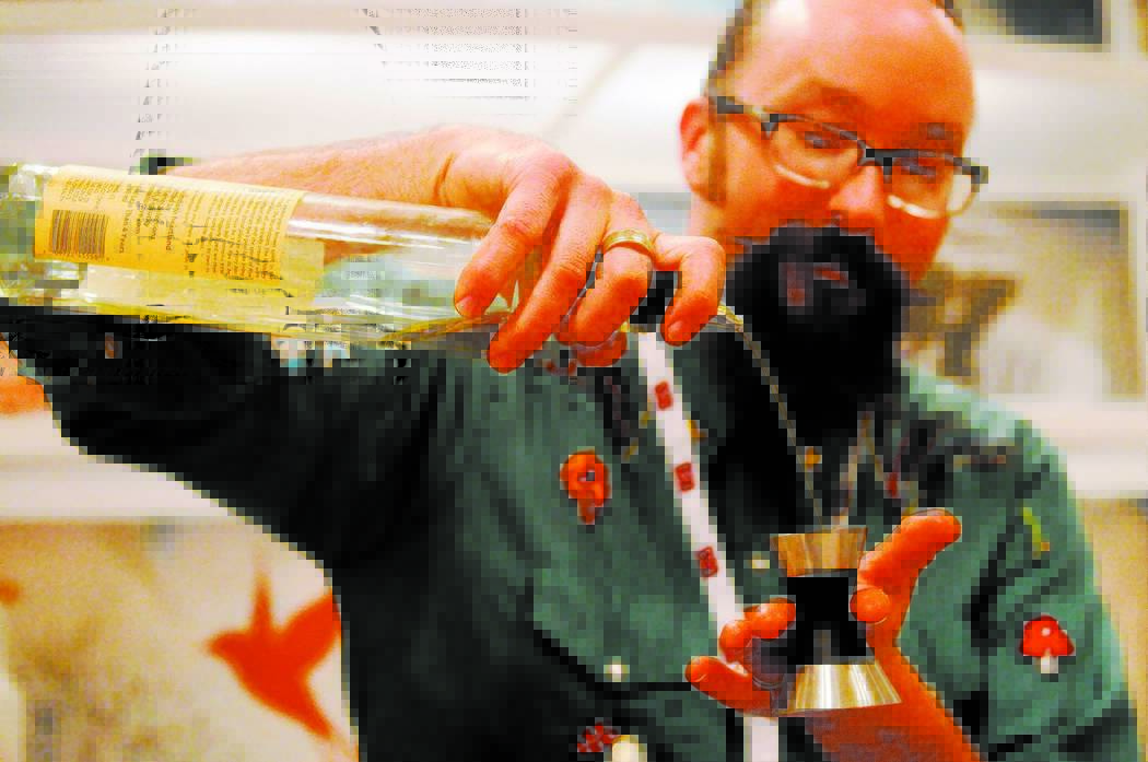 Adam Rains mixes drinks for LiDestri Spirits at their booth during the Wine & Spirits Wholesalers of America's 71st annual convention at the Caesars Palace casino-hotel in Las Vegas Tuesday, A ...