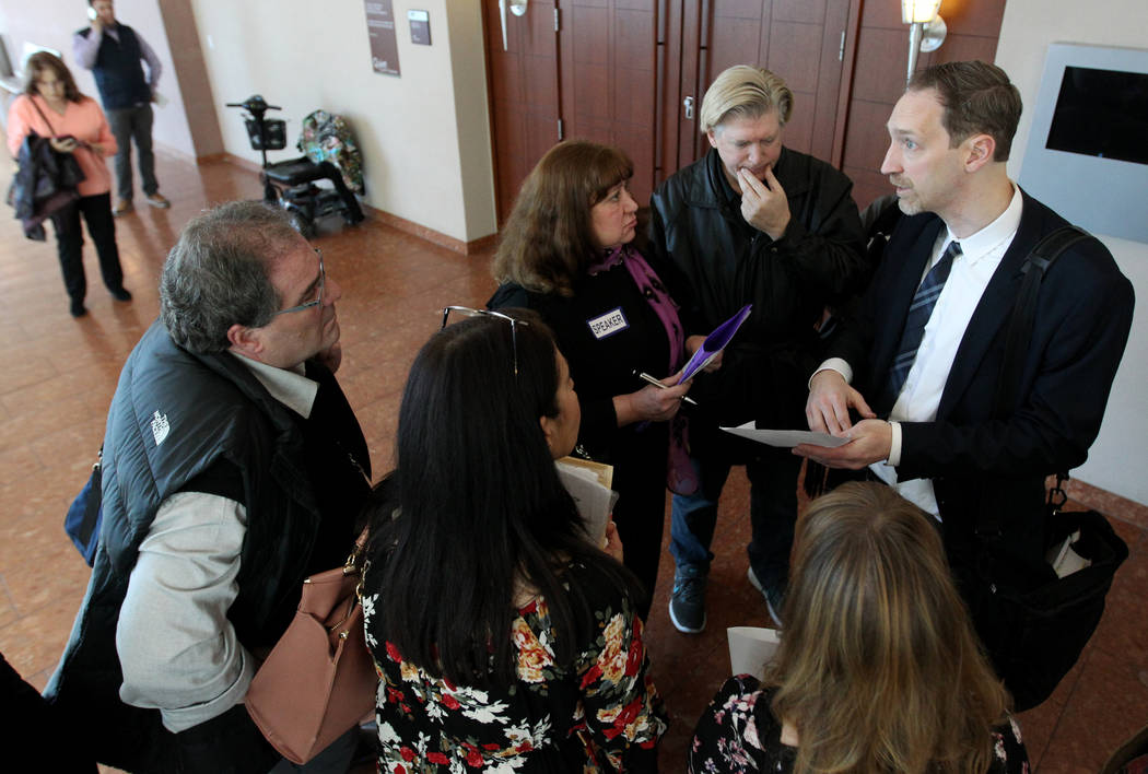 Senior Deputy Attorney General Daniel Westmeyer, right, talks to victims after sentencing for former Nevada guardian April Parks at the Regional Justice Center in Las Vegas Friday, Jan. 4, 2019. K ...