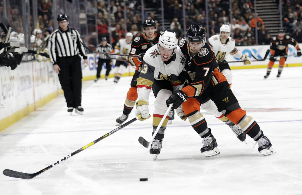 Vegas Golden Knights' Brayden McNabb (3) is defended by Anaheim Ducks' Andrew Cogliano (7) during the second period of an NHL hockey game Friday, Jan. 4, 2019, in Anaheim, Calif. (AP Photo/Marcio ...