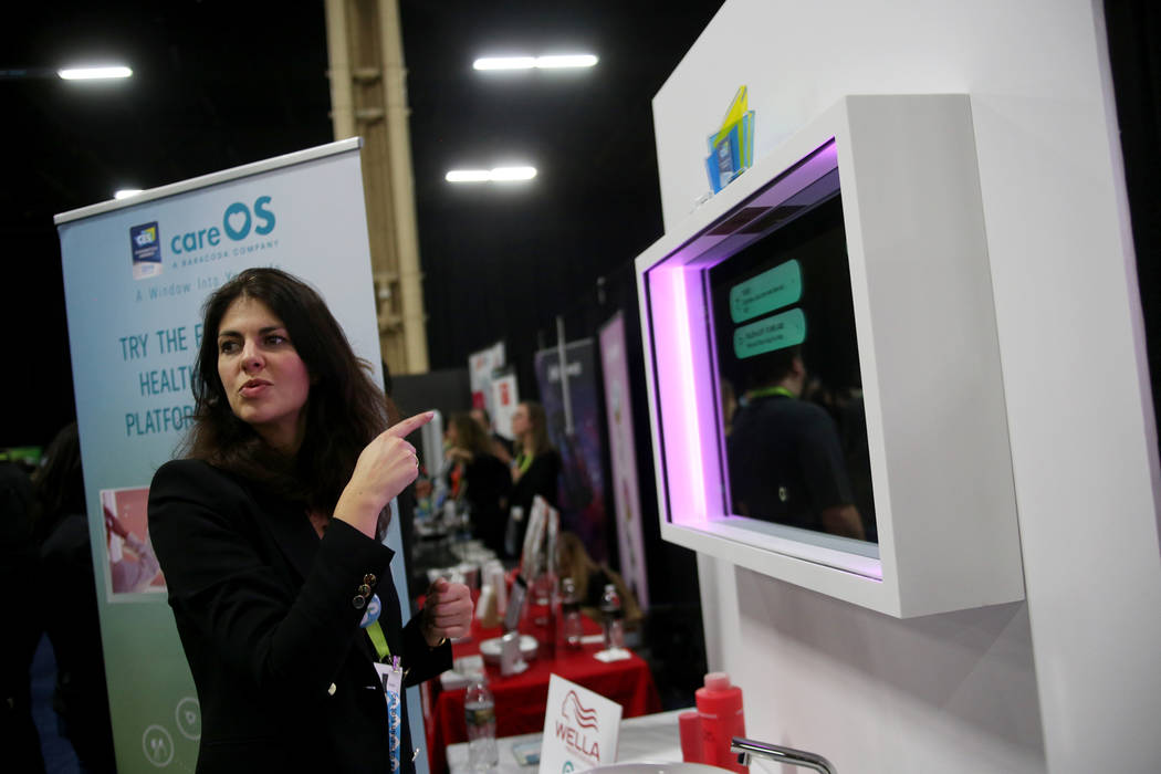 Chloe Szulzinger speaks to media about the Artemis smart mirror created by CareOS at the CES Unveiled event for media prefacing the tech mega-conference at Mandalay Bay in Las Vegas, Sunday, Jan. ...