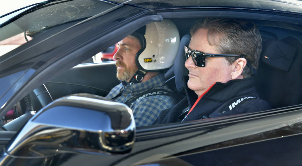 Passenger Sean McGee, left, prepares to go for a ride with former IndyCar driver Sam Schmidt, who now owns Schmidt Peterson Motorsports, at Speed Vegas at 14200 S. Las Vegas Blvd. in Las Vegas on ...