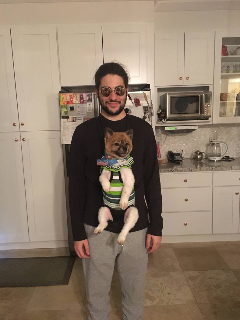 Aarash Taghdir with his family's dog, Marble. (Firouzeh Forouzmand)