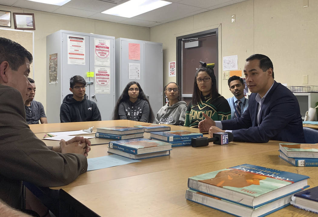 Former Obama housing chief Julian Castro, right, meets with students at Rancho High School in Las Vegas, Tuesday, Jan. 8, 2019. Castro has met with Nevada Democrats and leaders of the Latino commu ...