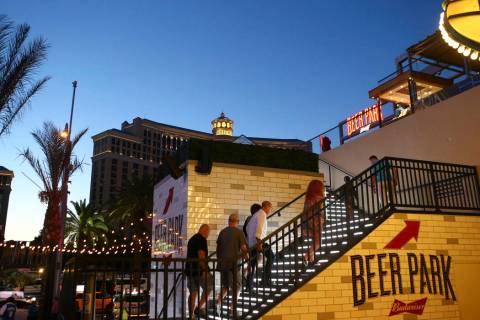People make their way to Beer Park at the Paris hotel-casino in Las Vegas on Friday, Nov. 4, 20 ...