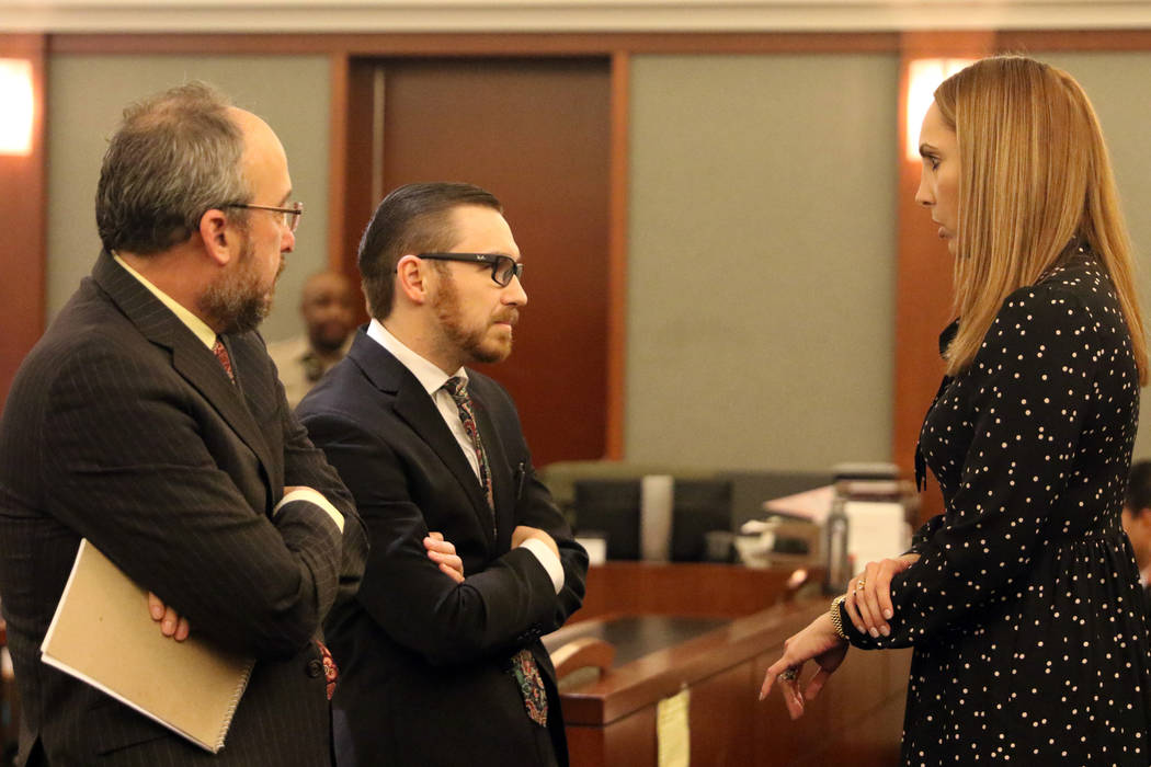 Attorney Alexis Plunkett, right, who prosecutors say bragged about putting a hit on her former boyfriend in prison, speaks to her lawyers, Michael Becker, left, and Adam Solinger prior to her cour ...