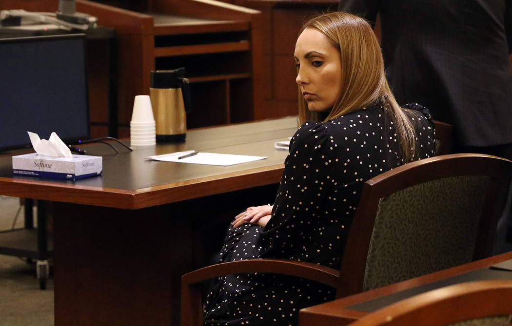 Attorney Alexis Plunkett, who prosecutors say bragged about putting a hit on her former boyfriend in prison, sits in the defendant chair during her court hearing, Thursday, Jan. 10, 2019, at the R ...