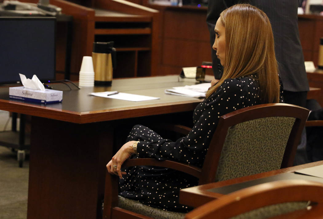 Attorney Alexis Plunkett, who prosecutors say bragged about putting a hit on her former boyfriend in prison, sits in the defendant chair during her court hearing, Thursday, Jan. 10, 2019, at the R ...