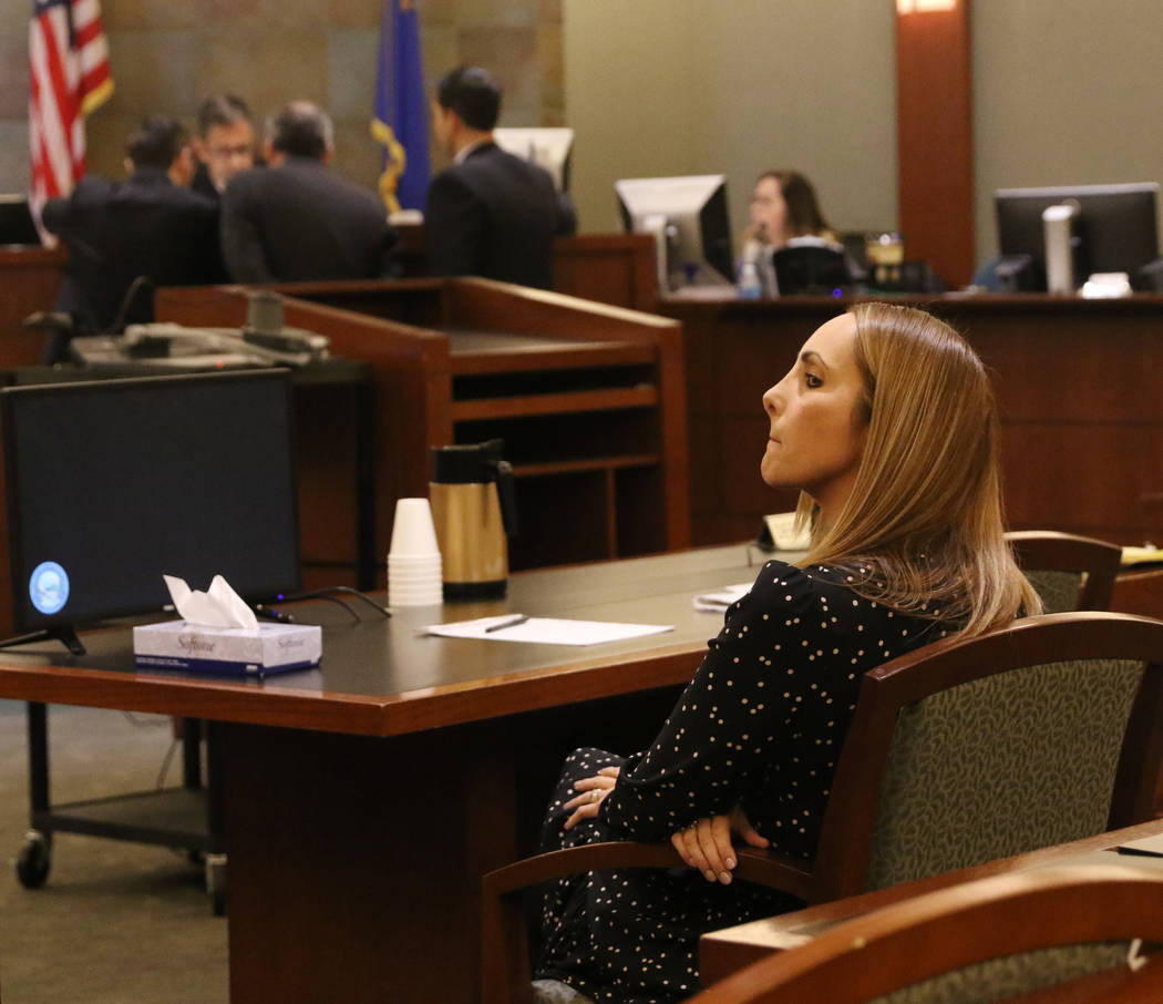 Attorney Alexis Plunkett, who prosecutors say bragged about putting a hit on her former boyfriend in prison, sits in the defendant chair during her court hearing, Thursday, Jan. 10, 2019, at the R ...