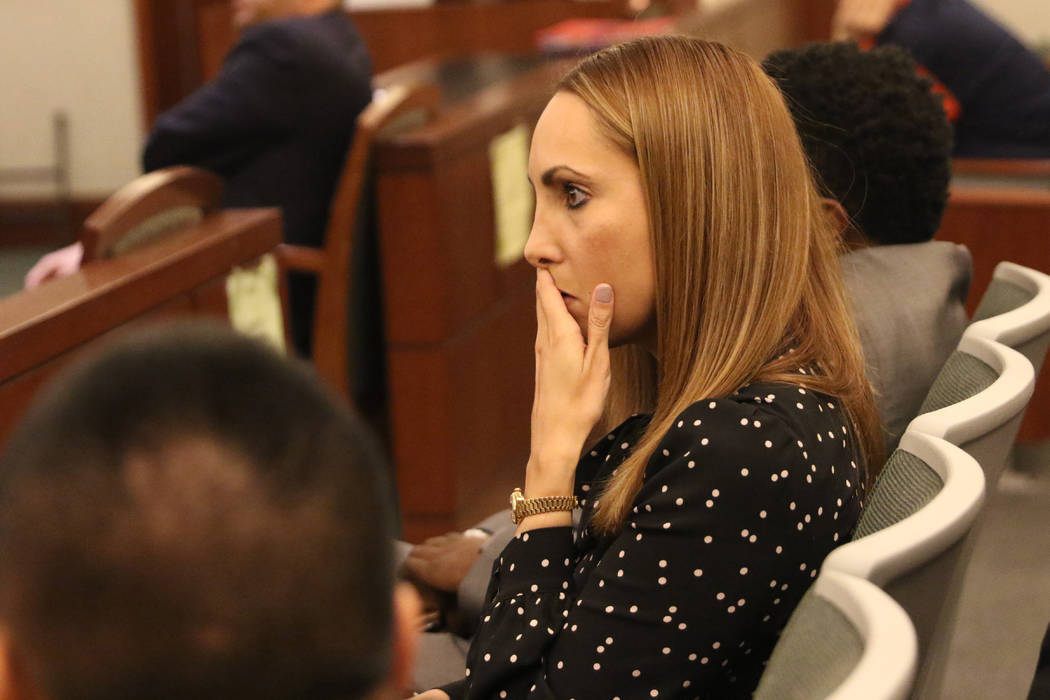 Attorney Alexis Plunkett, who prosecutors say bragged about putting a hit on her former boyfriend in prison, waits to be called for her court hearing on Thursday, Jan. 10, 2019, at the Regional Ju ...