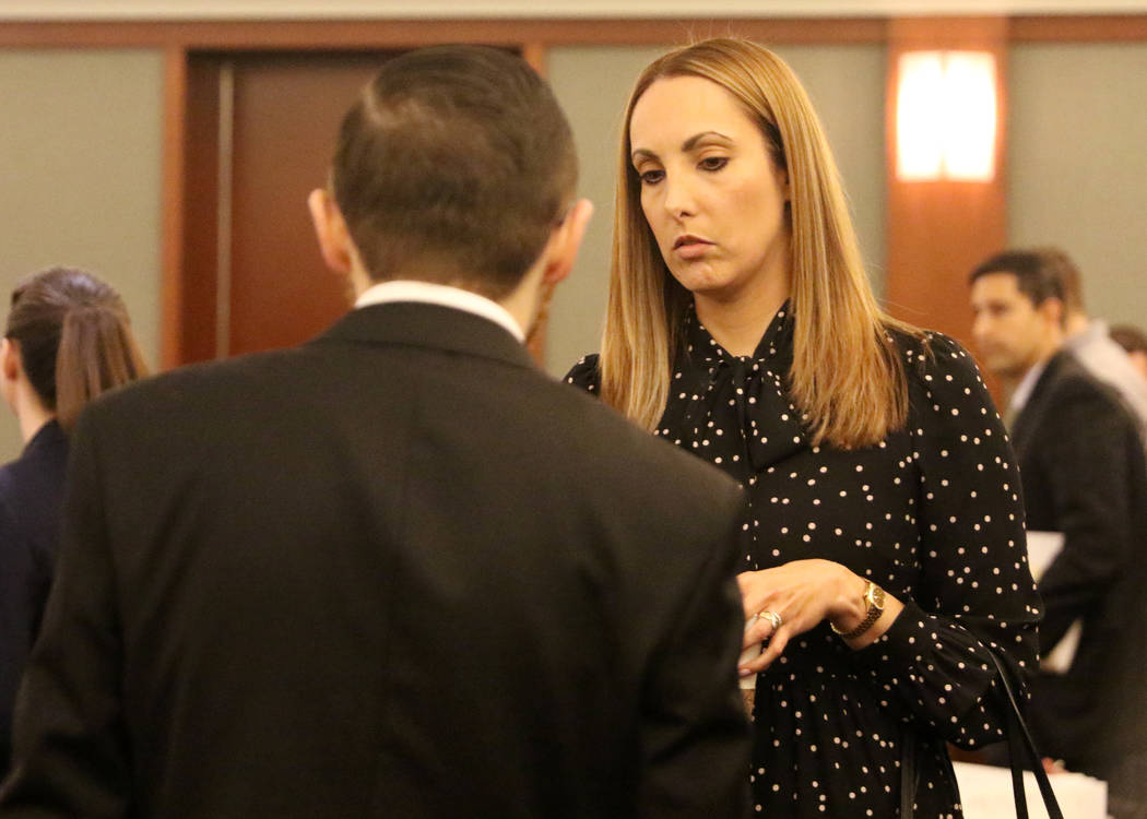 Attorney Alexis Plunkett, who prosecutors say bragged about putting a hit on her former boyfriend in prison, enters the courtroom prior to her hearing on Thursday, Jan. 10, 2019, at the Regional J ...