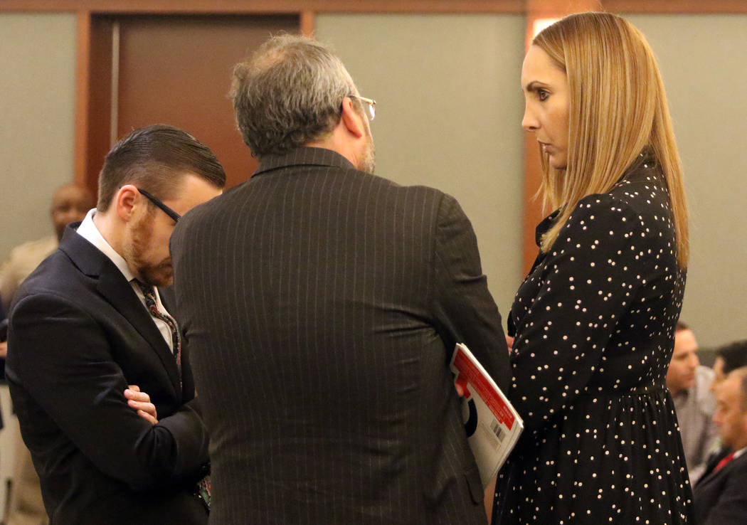Attorney Alexis Plunkett, right, who prosecutors say bragged about putting a hit on her former boyfriend in prison, converses with her lawyers, Michael Becker, center, and Adam Solinger prior to h ...