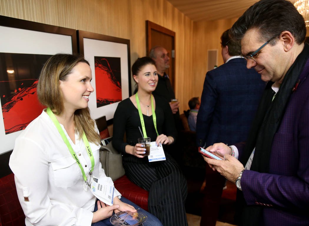 John Katsilometes interviews Sierra Dasso, left, and Taylor Lemmon of San Francisco during the Hardware Massive CES 2019 Happy Hour Bash at The Hangover Suite at Caesars Palace in Las Vegas Wednes ...