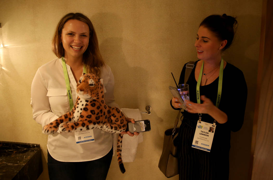 Sierra Dasso, left, and Taylor Lemmon of San Francisco pose with a tiger plush toy during the Hardware Massive CES 2019 Happy Hour Bash at The Hangover Suite at Caesars Palace in Las Vegas Wednes ...