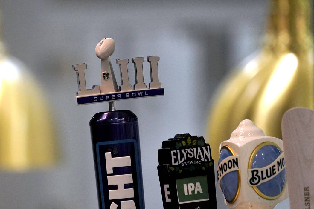 A Super Bowl LIII logo beer tap is shown during a tour of Mercedes-Benz Stadium for the NFL Super Bowl 53 football game Tuesday, Jan. 29, 2019, in Atlanta. (AP Photo/David J. Phillip)