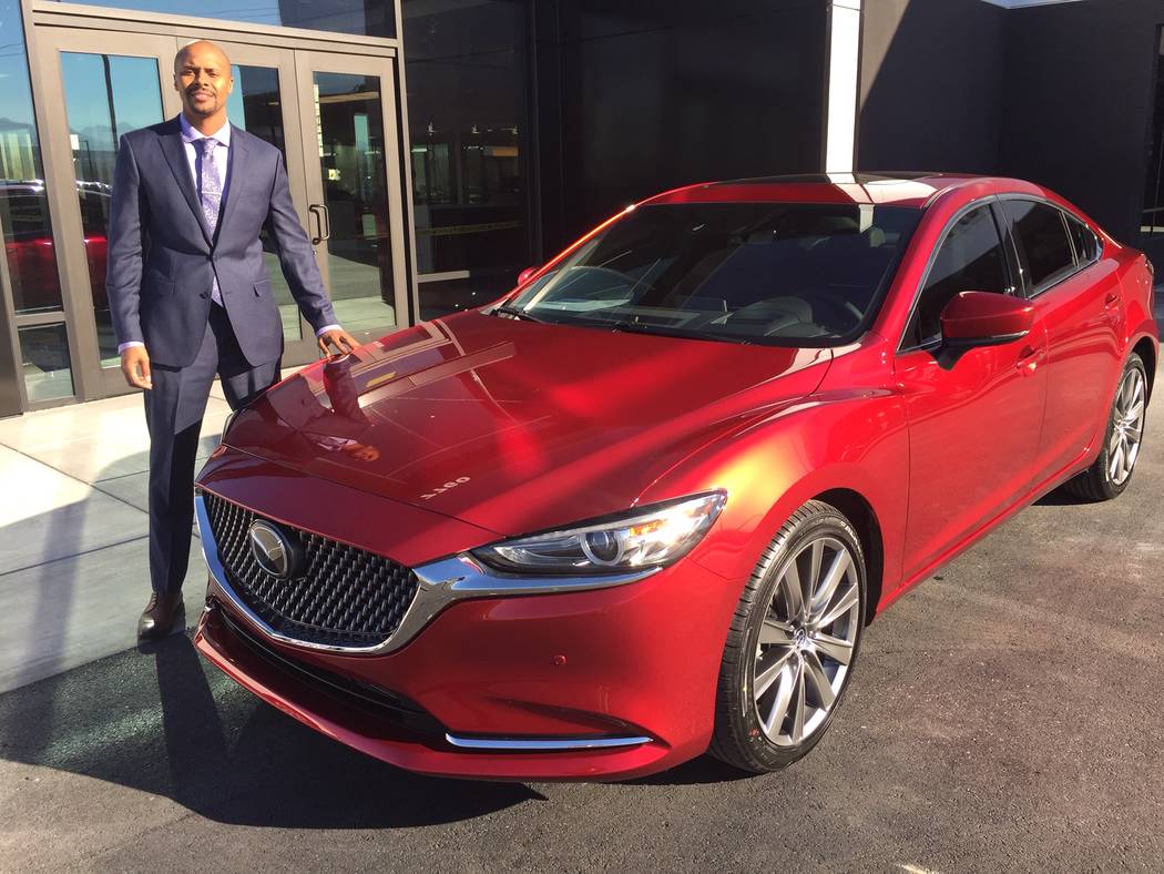 Findlay Mazda General Manager Allen Montalvo is seen with a 2018 Mazda6 model at the new dealership situated at 7760 Eastgate Road in the Valley Automall. (Findlay)