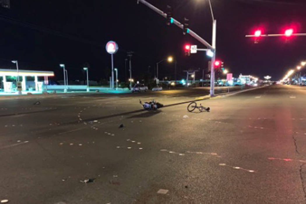 A bicyclist died early Saturday after he was struck by a suspected impaired motorcyclist and thrown into a vehicle east of downtown Las Vegas. (@LVMPD_Traffic/Twitter)