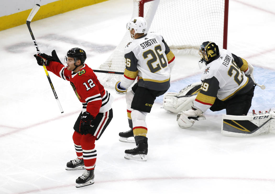 Chicago Blackhawks left wing Alex DeBrincat (12) celebrates after his goal against the Vegas Golden Knights, during the first period of an NHL hockey game Saturday, Jan. 12, 2019, in Chicago. (AP ...