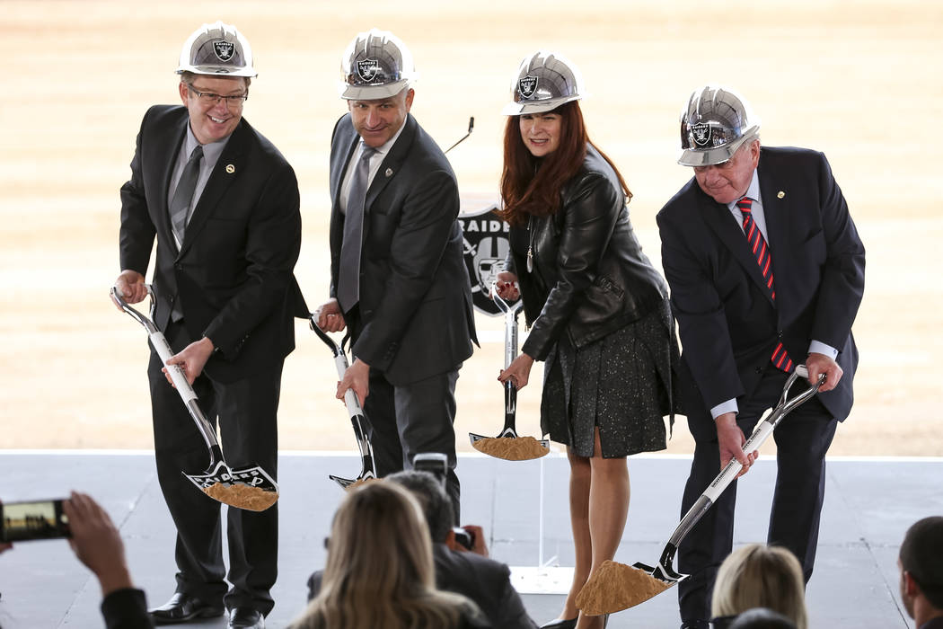 From left, Henderson City Manager Richard Derrick, Raiders President Marc Badain, Henderson Mayor Debra March and Henderson Councilman Dan Shaw pose for photos during a groundbreaking ceremony for ...