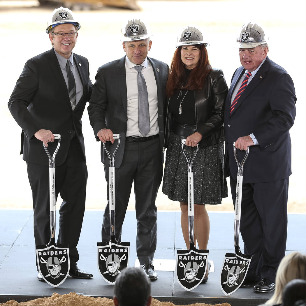From left, Henderson City Manager Richard Derrick, Raiders President Marc Badain, Henderson Mayor Debra March and Henderson Councilman Dan Shaw pose for photos during a groundbreaking ceremony for ...