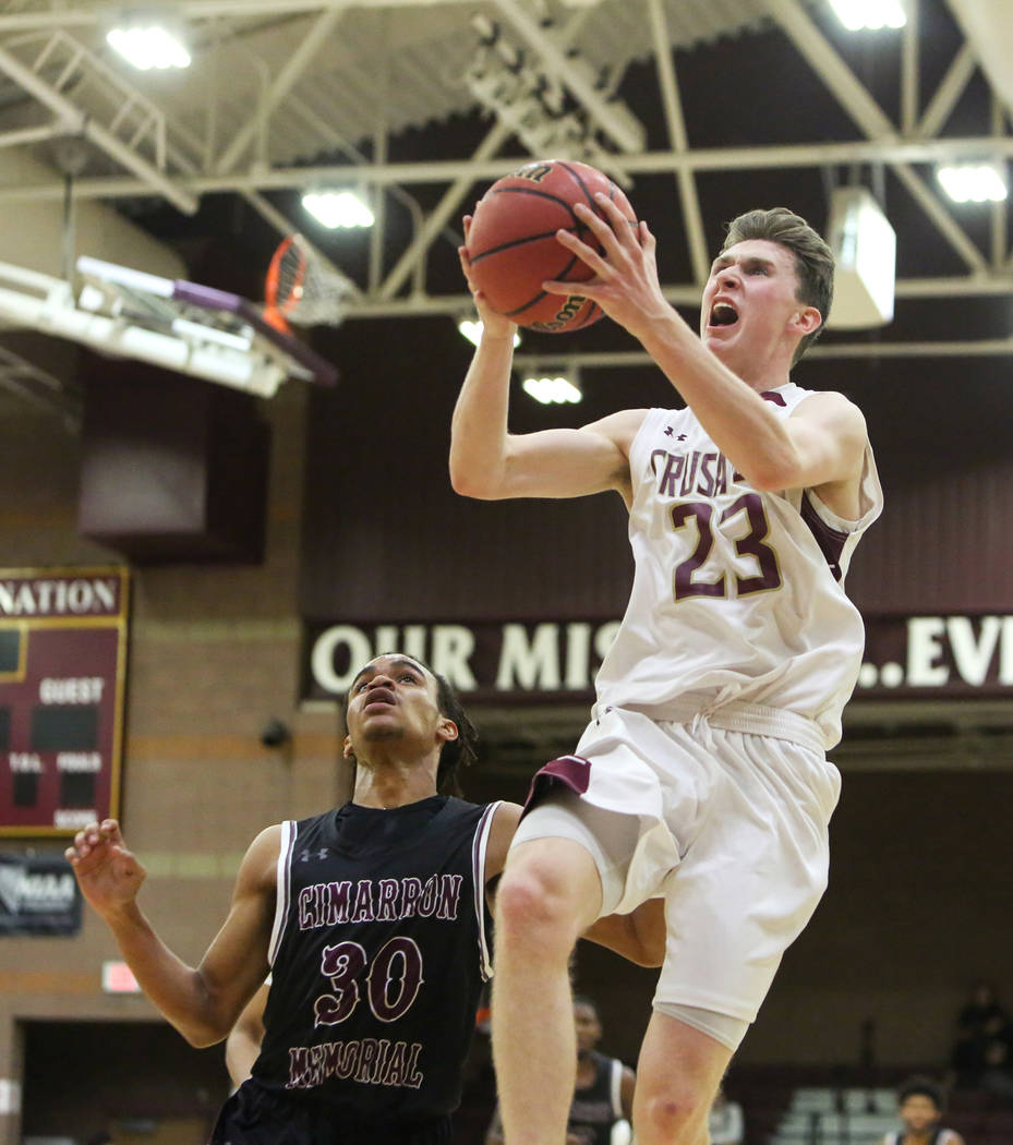 Faith Lutheran's Brevin Walter (23) goes to shoot the ball as Cimarron Memorial's Kevin Johnson (30) trails behind during the first half of a basketball game at Faith Lutheran High School in Las V ...