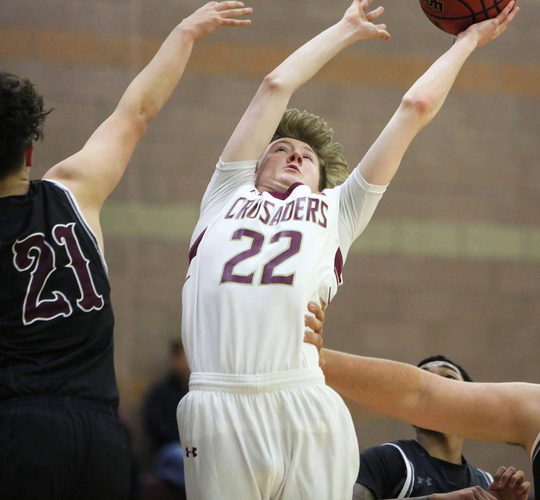 Faith Lutheran's Nick Attanasio (22) reaches for the ball while under pressure from Cimarron Memorial's Noah Do (21) during the second half of a basketball game at Faith Lutheran High School in La ...
