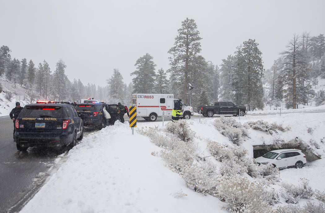 Nevada State Troopers investigate a Hyundai Santa Fe that careened into a drainage ditch at Mount Charleston on Tuesday, Jan. 15, 2019, in Las Vegas. Benjamin Hager Las Vegas Review-Journal