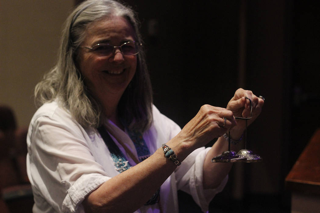 Frances Meyer, a healing touch practitioner who performed at the Crystal Singing Bowls event alongside Ann Vanoy holds tingsha bells, used for mediation. (Mia Sims/Las Vegas Review-Journal @miasim ...