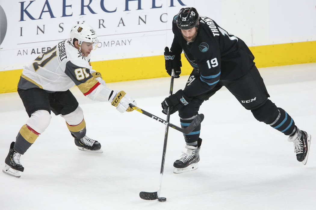 Vegas Golden Knights center Jonathan Marchessault (81) defends against San Jose Sharks center Joe Thornton (19) during the first period of an NHL hockey game at T-Mobile Arena in Las Vegas on Thur ...