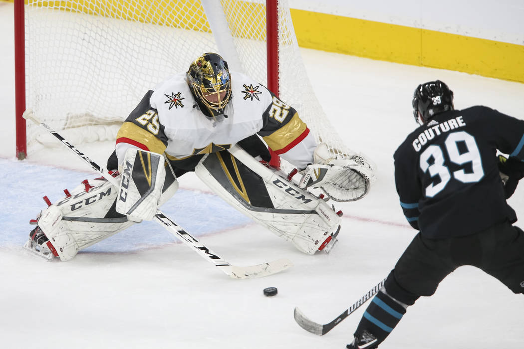 Vegas Golden Knights goaltender Marc-Andre Fleury (29) deflects an attempt by San Jose Sharks center Logan Couture (39) during the first period of an NHL hockey game at T-Mobile Arena in Las Vegas ...
