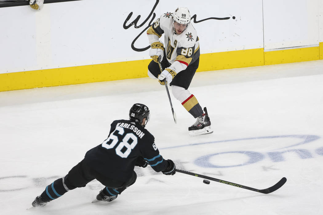 Vegas Golden Knights defenseman Nate Schmidt (88) passes the puck against San Jose Sharks center Melker Karlsson (68) during the third period of an NHL hockey game at T-Mobile Arena in Las Vegas o ...