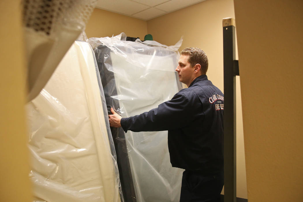 Engineer Travis Jackson stacks a mattress in a dorm at Fire Station 22 in Las Vegas, Wednesday, Jan. 16, 2019. Walker Furniture delivered new mattresses to all 30 Clark County firehouses in the La ...