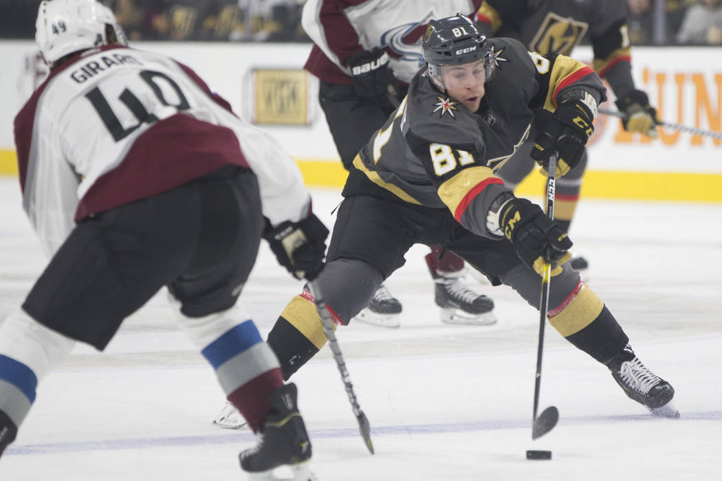 Golden Knights center Jonathan Marchessault (81) fights for a loose puck with Colorado Avalanche defenseman Samuel Girard (49) in the first period on Thursday, Dec. 27, 2018, at T-Mobile Arena, in ...
