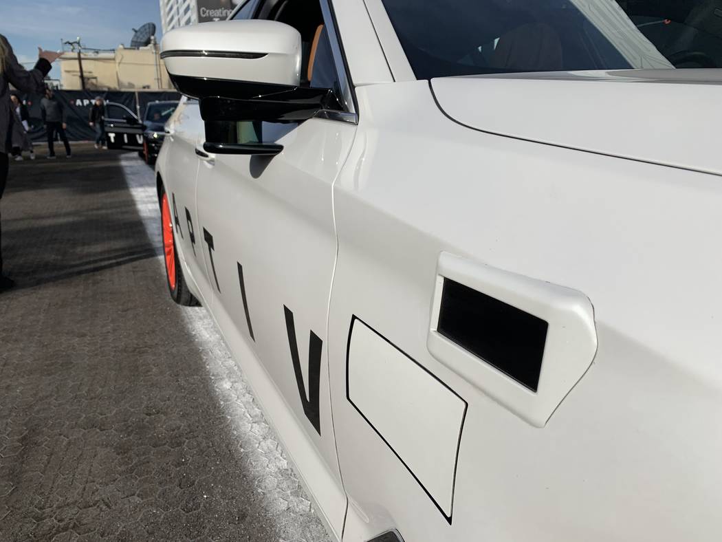 The Aptiv self-driving BMW on the Lyft platform features a short-range LiDAR radar on the side view mirror, an electronically scanning radar and a long-range LiDAR above the front wheel well of th ...