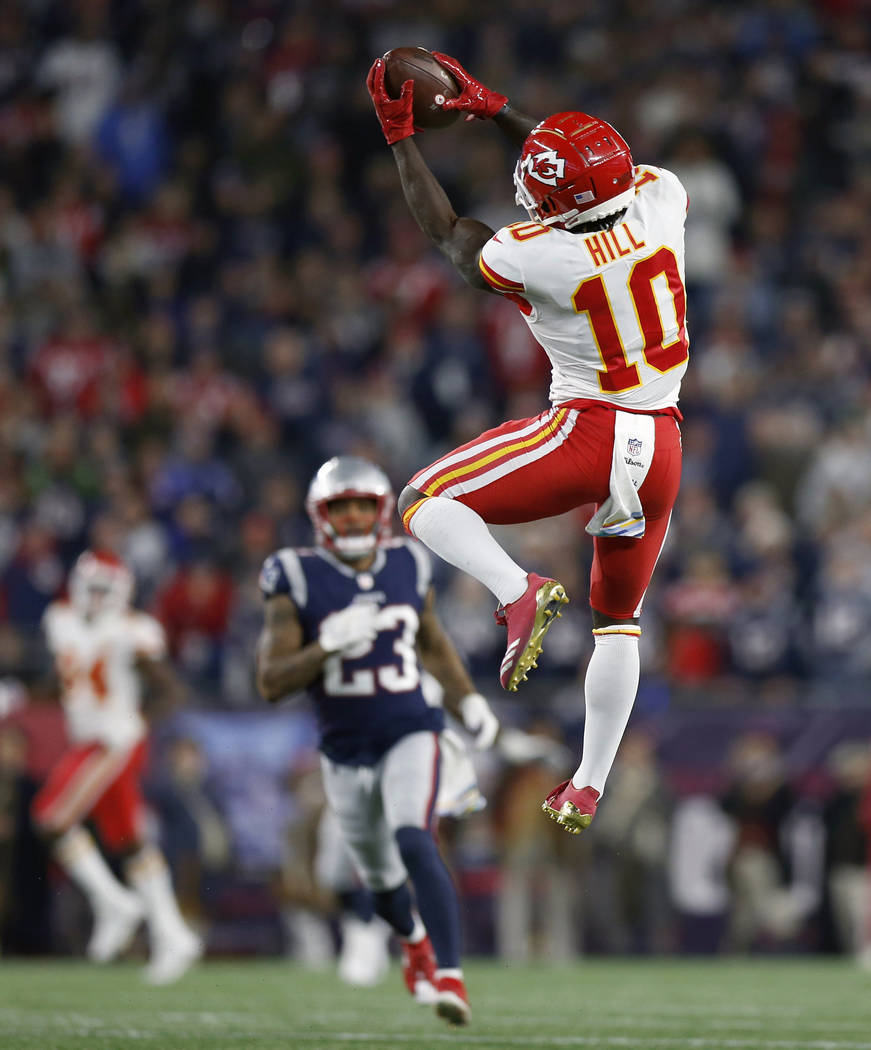 FILE - In this Oct. 14, 2018, file photo, Kansas City Chiefs wide receiver Tyreek Hill (10) catches a pass that he ran in for a touchdown during the second half of an NFL football game against the ...