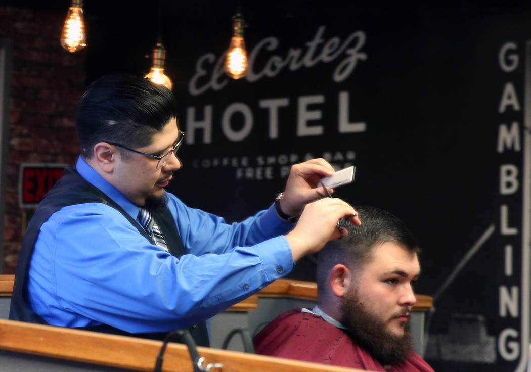 Barber Andres Dominguez cuts Kyle Lamb's hair at his Speakeasy Barbershop LV at El Cortez hotel-casino on Saturday, Jan. 19, 2019, in Las Vegas. Bizuayehu Tesfaye/Las Vegas Review-Journal @bizutesfaye