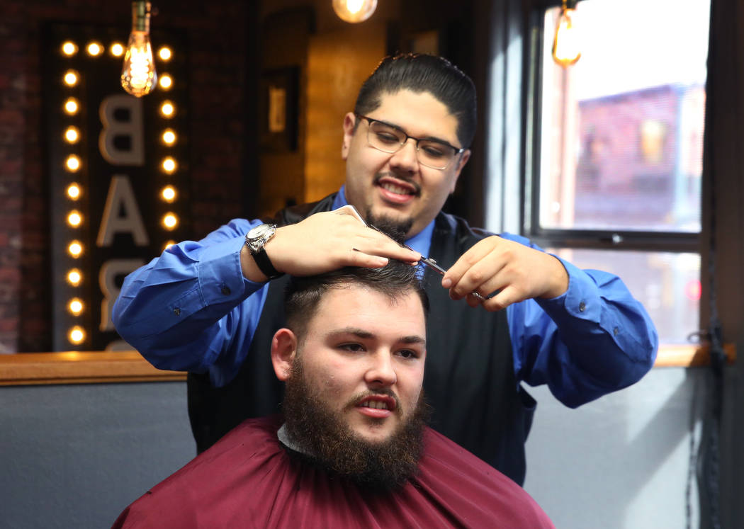 Barber Andres Dominguez cuts Kyle Lamb's hair at his Speakeasy Barbershop LV at El Cortez hotel-casino on Saturday, Jan. 19, 2019, in Las Vegas. Bizuayehu Tesfaye/Las Vegas Review-Journal @bizutesfaye