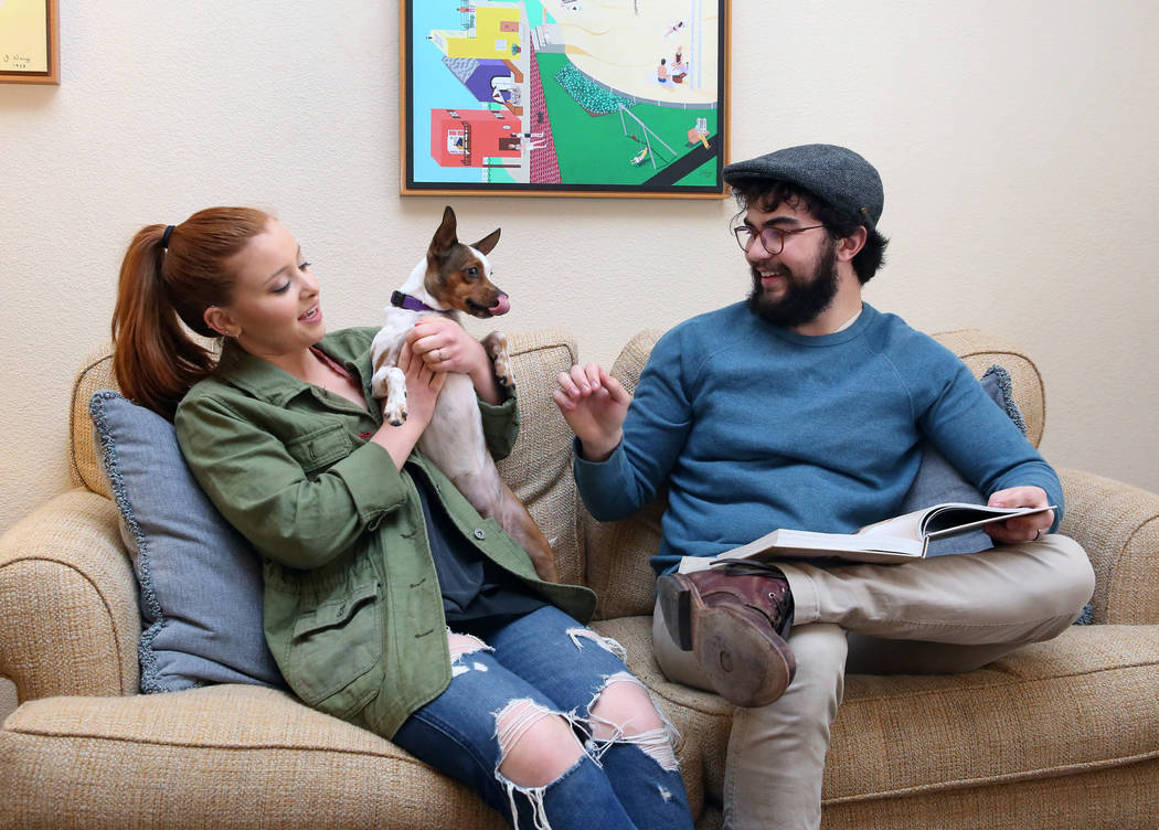 Emma Gould, 22, left, and her fiance Alex Weisz, 22, relax with their dog Winky at their Summerlin home on Tuesday, Jan. 22, 2019, in Las Vegas. Weisz and Gould moved from Los Angeles and bought t ...