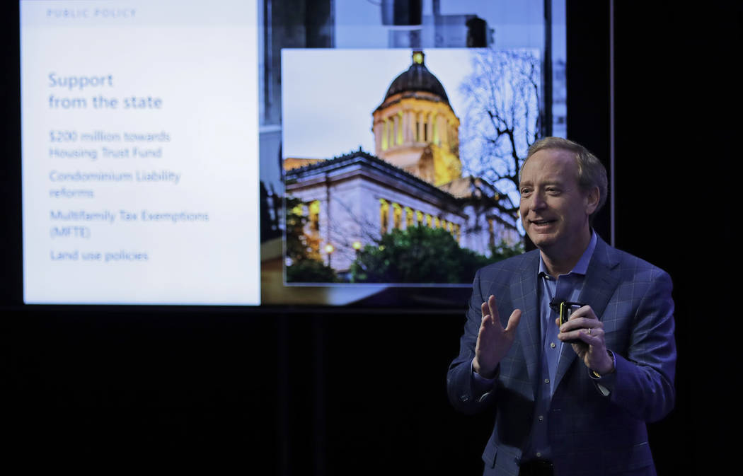 Microsoft President Brad Smith speaks Thursday, Jan. 17, 2019, during a presentation in Bellevue, Wash., to announce a $500 million pledge by Microsoft Corp. to develop affordable housing for low- ...