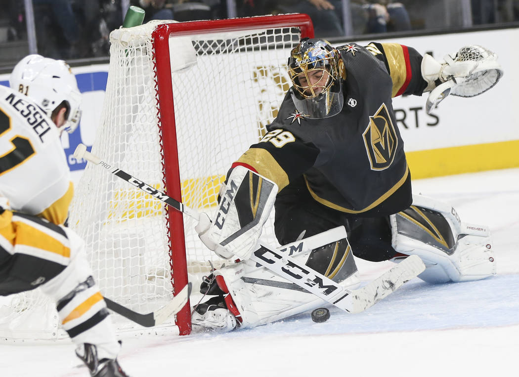 Golden Knights goaltender Marc-Andre Fleury (29) blocks a shot from Pittsburgh Penguins right wing Phil Kessel during the second period of an NHL hockey game at T-Mobile Arena in Las Vegas on Satu ...