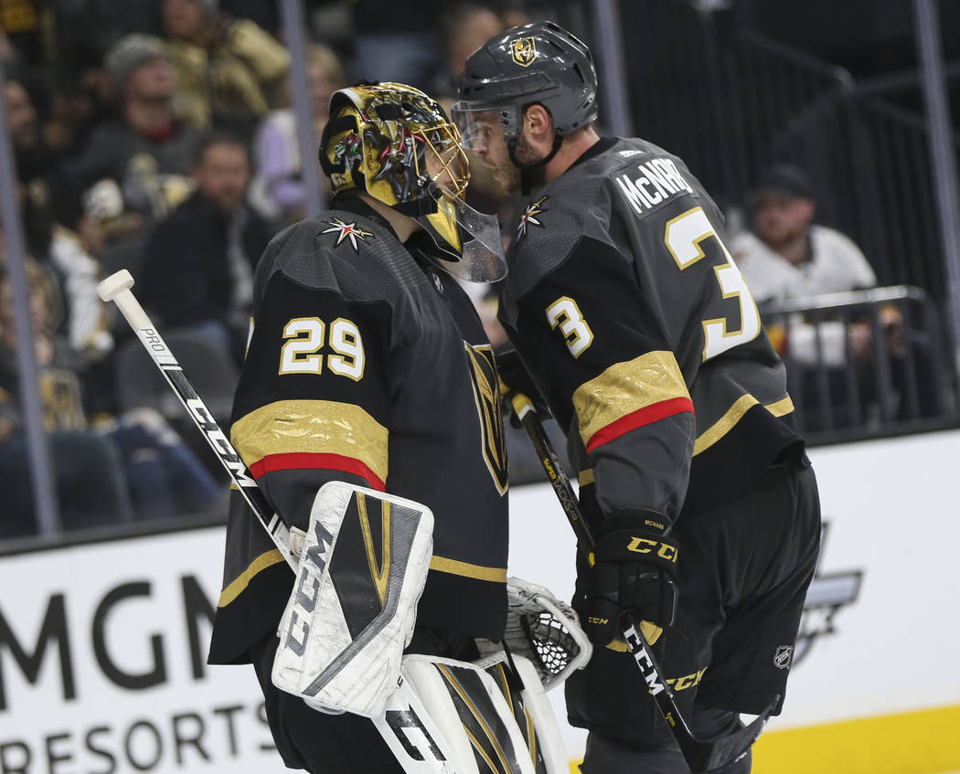 Golden Knights goaltender Marc-Andre Fleury (29) talks with defenseman Brayden McNabb (3) during the second period of an NHL hockey game against the Pittsburgh Penguins at T-Mobile Arena in Las Ve ...