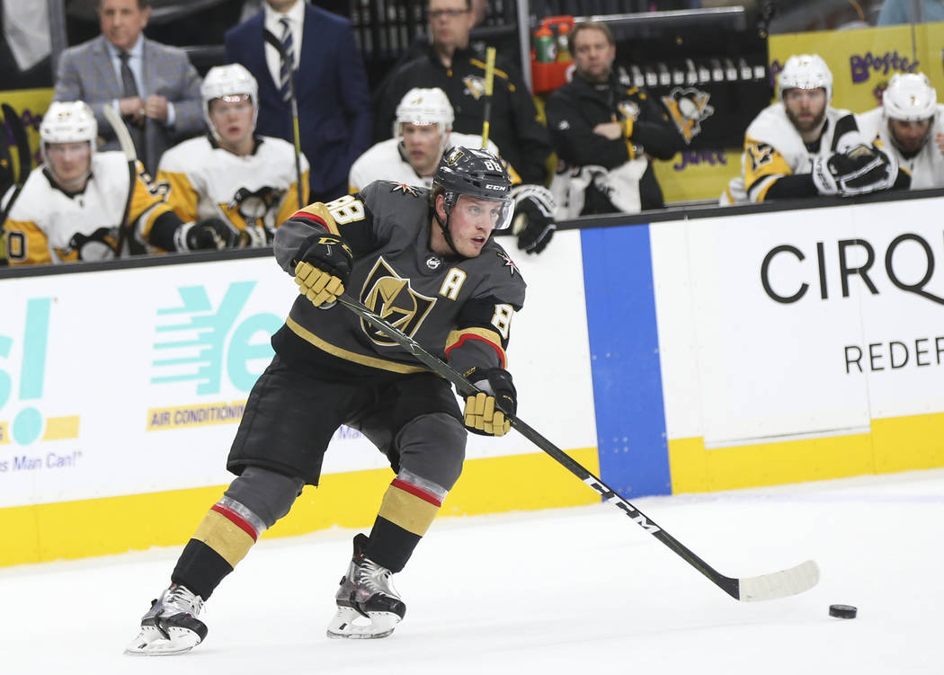 Golden Knights defenseman Nate Schmidt (88) moves the puck against the Pittsburgh Penguins during the first period of an NHL hockey game at T-Mobile Arena in Las Vegas on Saturday, Jan. 19, 2019. ...