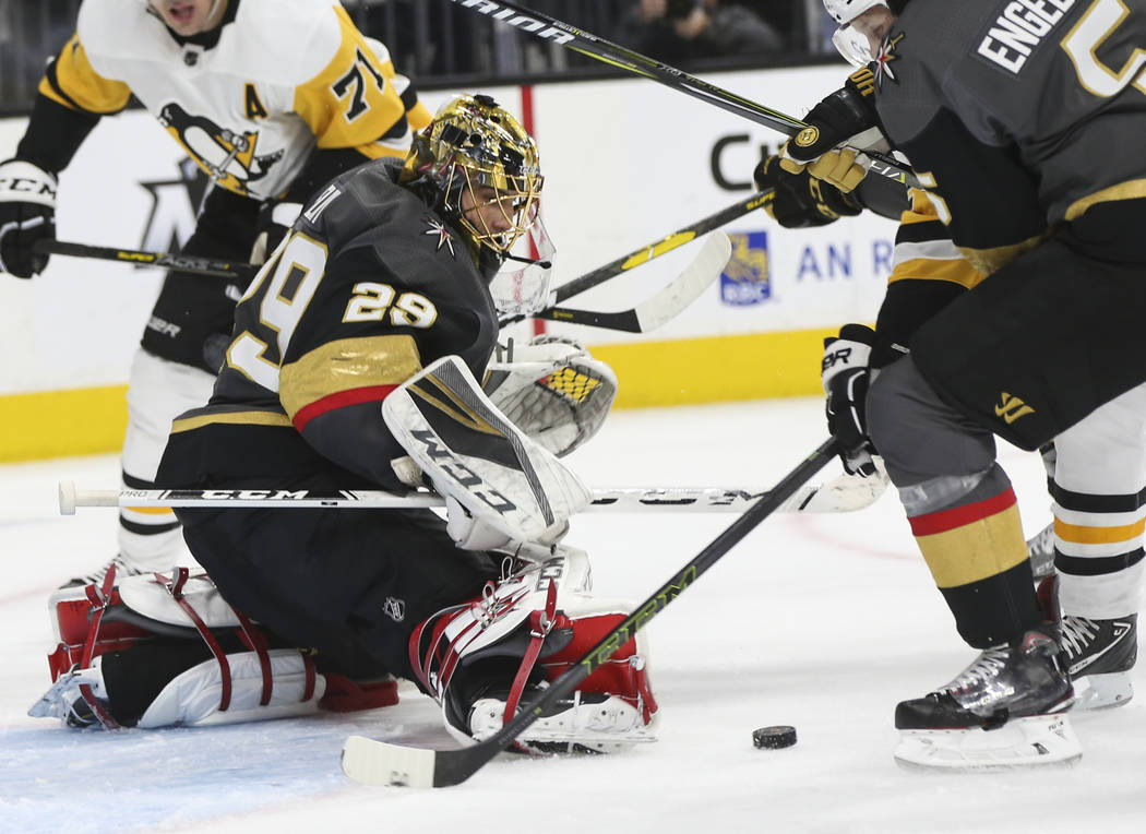 Golden Knights goaltender Marc-Andre Fleury (29) defends the net during the second period of an NHL hockey game against the Pittsburgh Penguins at T-Mobile Arena in Las Vegas on Saturday, Jan. 19, ...