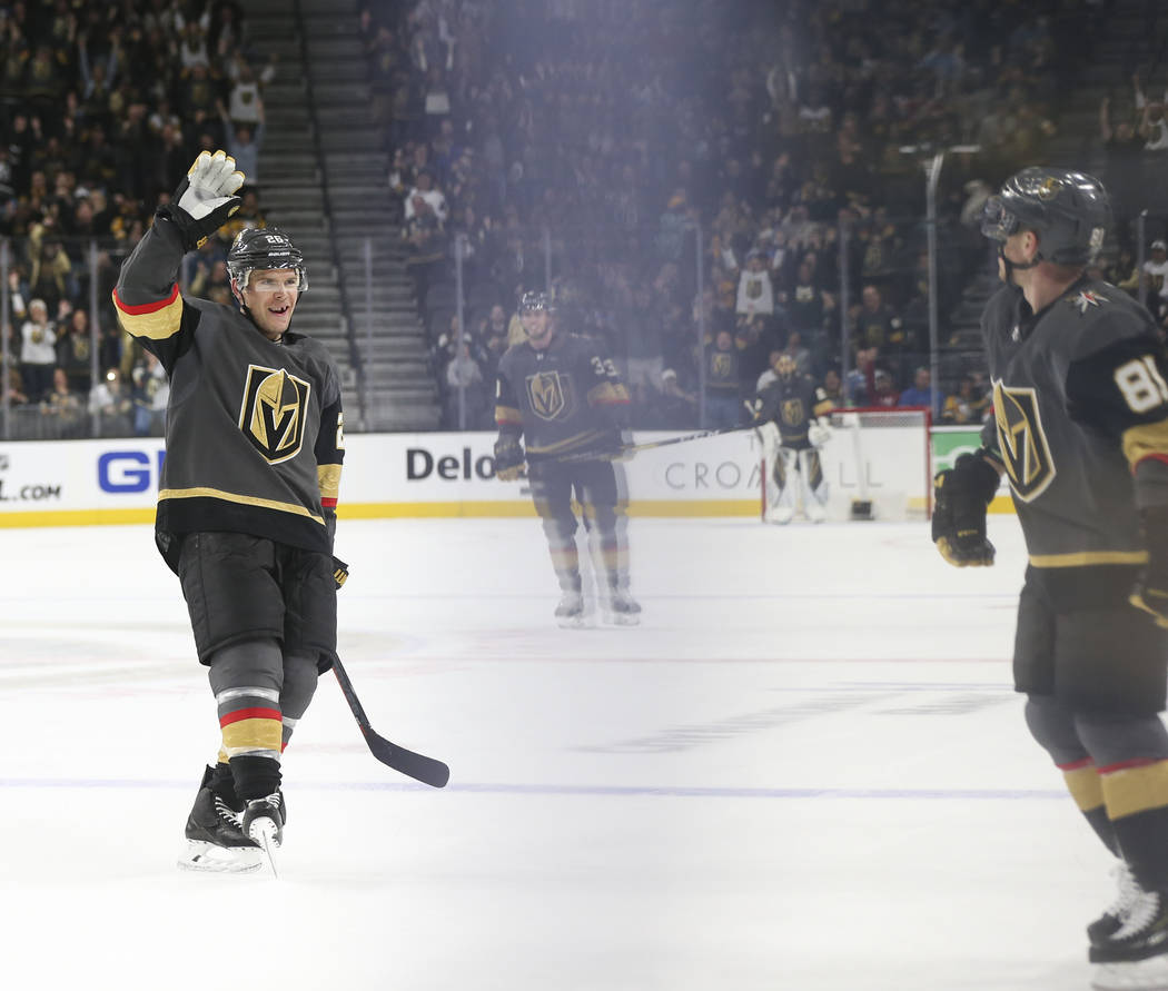 Golden Knights center Paul Stastny, left, celebrates a goal by Golden Knights center Jonathan Marchessault, right, during the third period of an NHL hockey game at T-Mobile Arena in Las Vegas on S ...