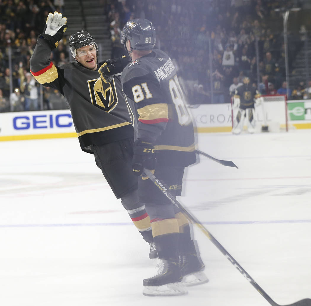Golden Knights center Paul Stastny, left, celebrates a goal by Golden Knights center Jonathan Marchessault, right, during the third period of an NHL hockey game at T-Mobile Arena in Las Vegas on S ...